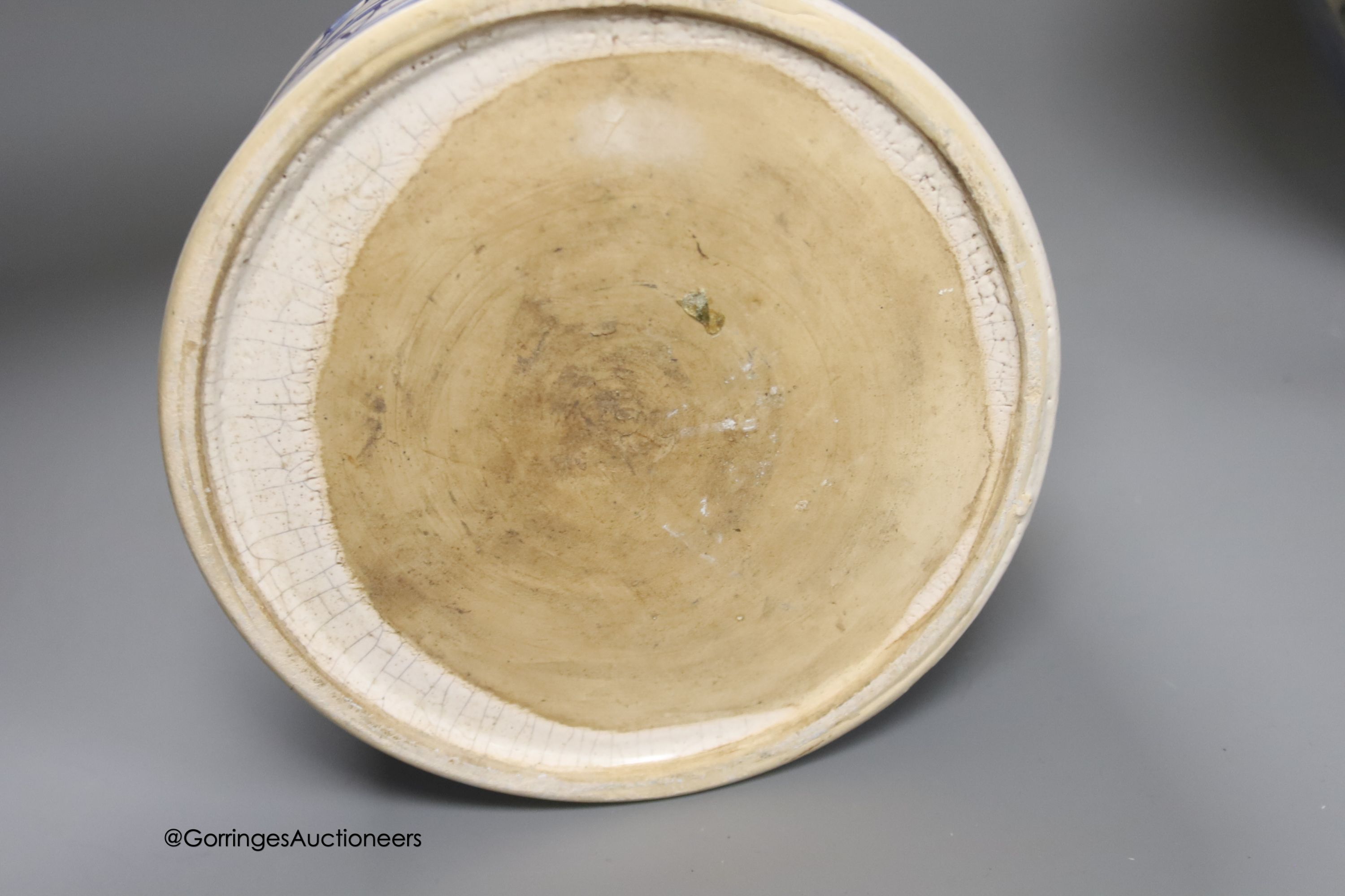 A tin-glazed terracotta barber's bowl dated 1819, a large ovoid eathenware ‘Taback’ jar and three earthenware jugs